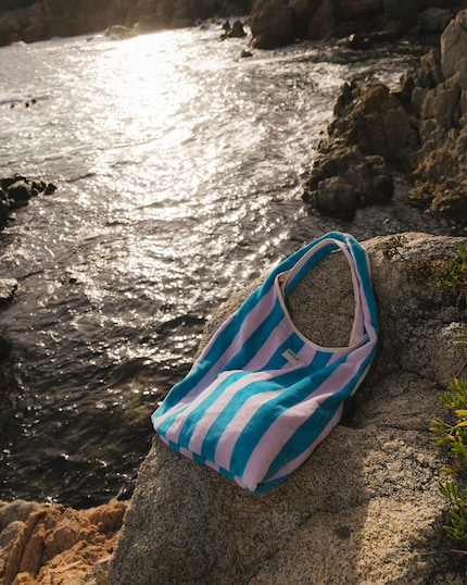 This colourful striped bag from Wouf makes you want to go for a swim.