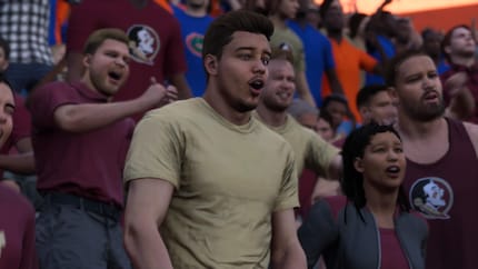 This fan is totally amazed. Another fan celebrates in the background.