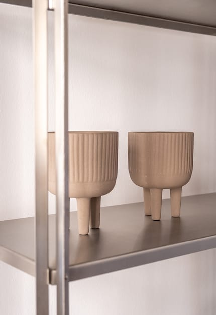 The texture of these planters resembles that of classic columns.