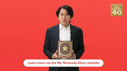 Yoshiaki Koizumi, director of both games, presents the collector's item.